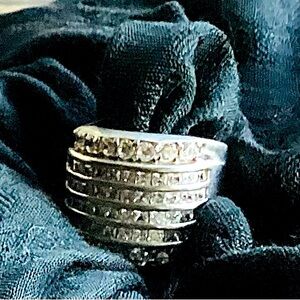 Layered white gold Moissanite eternity band.
